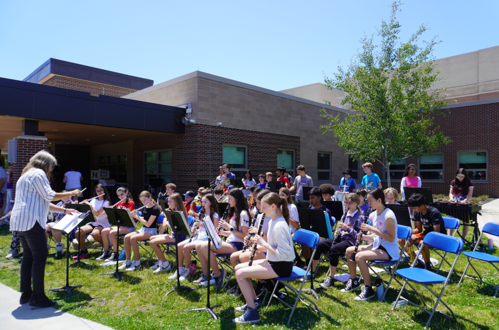 middle school band performing outdoors