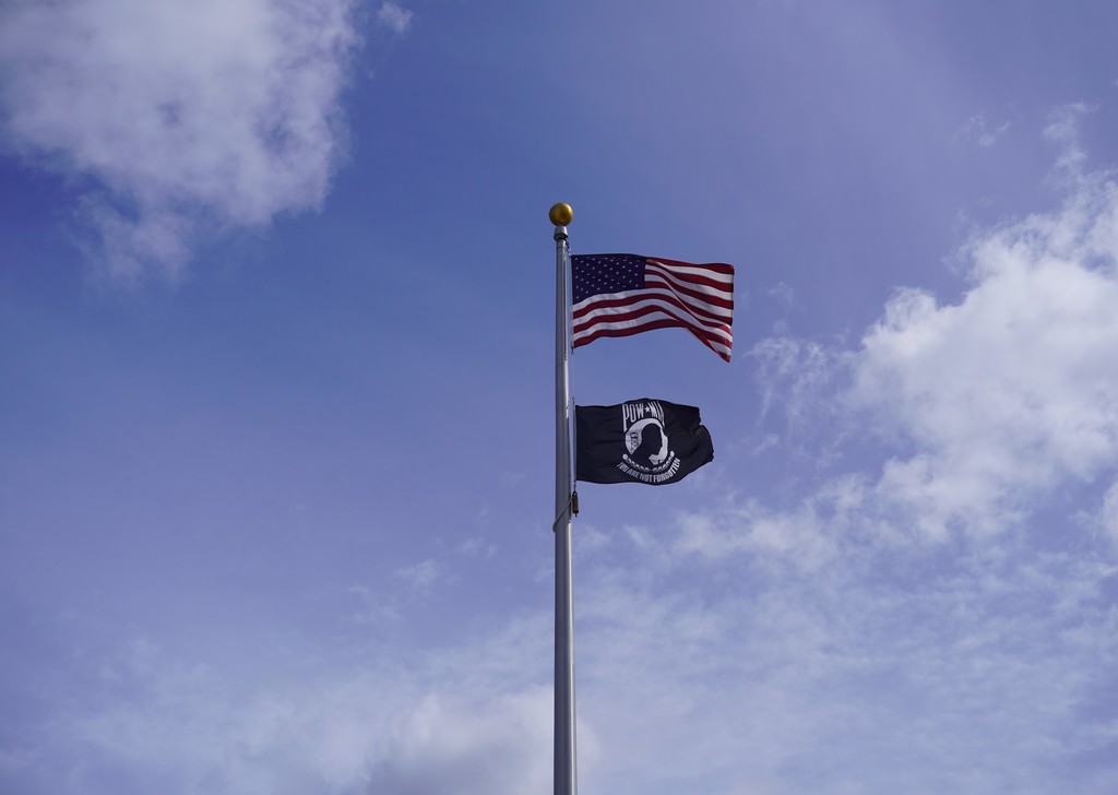 Flagpole with US flag and POWMIA flag
